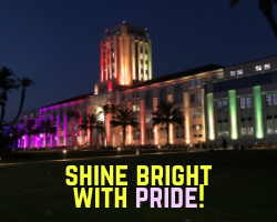 CAC building lit up with pride colors